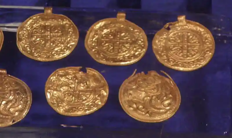 Gold solar disc pendants